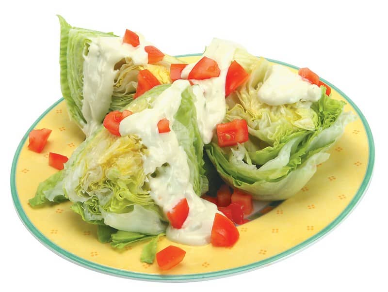 Iceberg Lettuce with Tomatoes and Dressing Food Picture