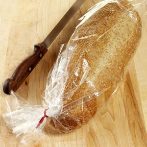 Bakery Fresh Whole Wheat Bread Loaf on Pine Countertop Food Picture