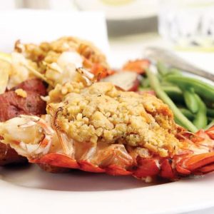 Baked stuffed lobster tail with green beans and lemon Food Picture