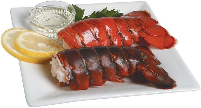 Cooked Lobster Tails with Lemon Slices and Sauce Food Picture