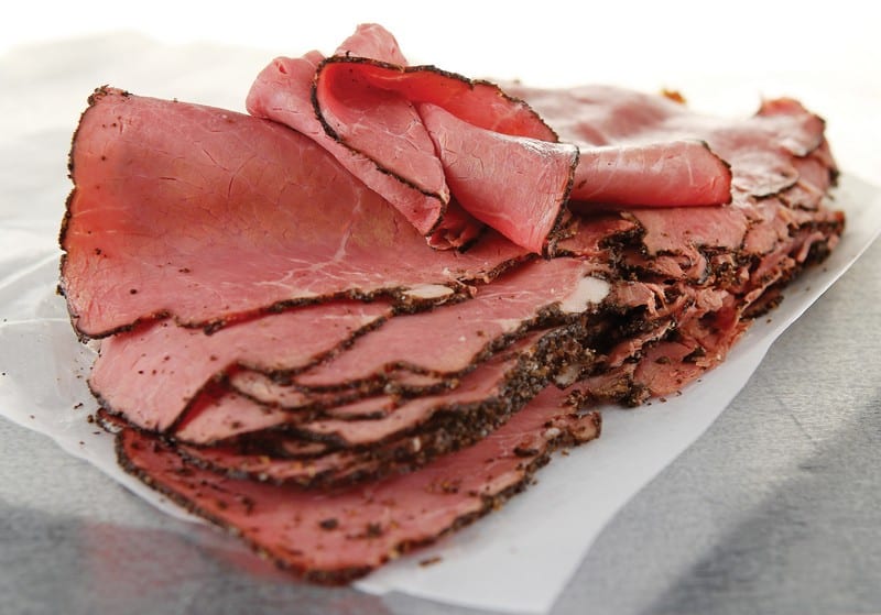 Pile of Deli Pastrami on Table Food Picture