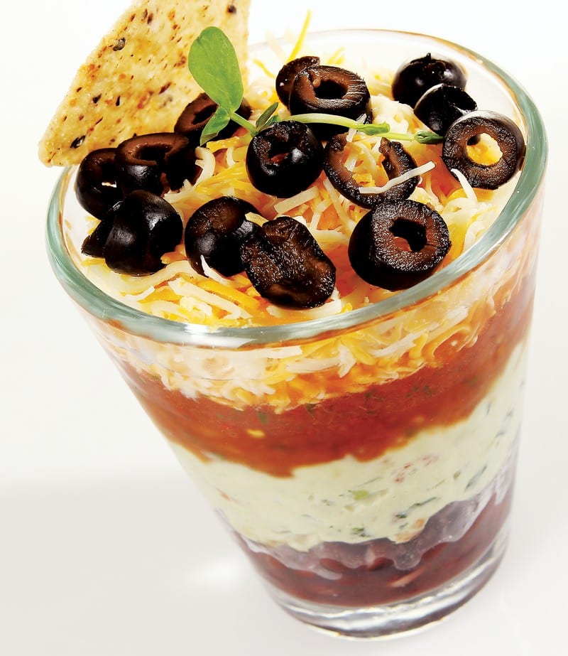 Mexican Five Layer Dip in Tall Glass Food Picture