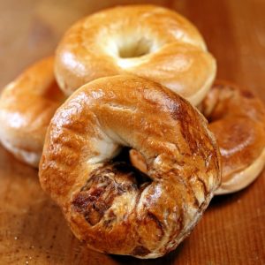 Fresh Multiple Mini Bagels on a Wooden Table Food Picture