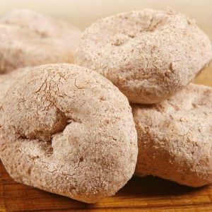 Cinnamon Sugar Powdered Homestyle Donuts on Hardwood Tabletop Food Picture