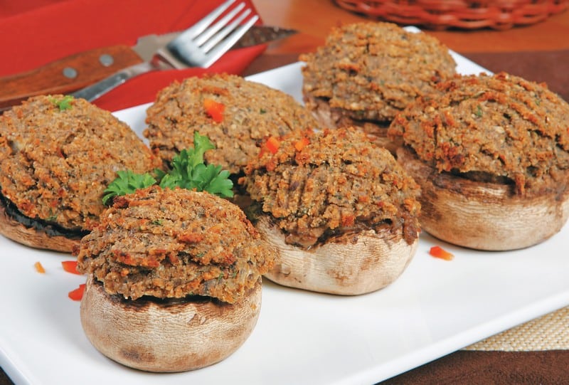 Stuffed mushrooms on white plate with red napkin Food Picture