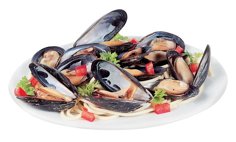Mussels over Pasta with Garnish in White Dish Food Picture