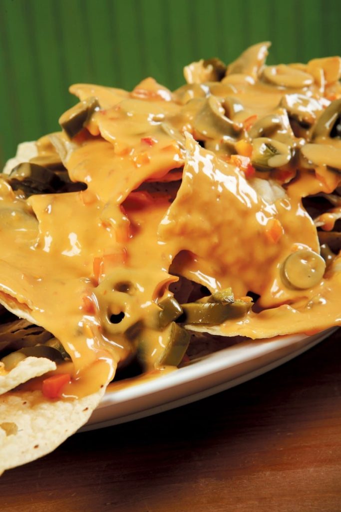 Nachos with Cheese on Wooden Surface Food Picture