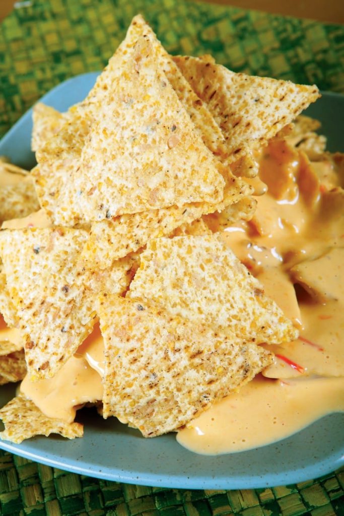 Nachos with Cheese Sauce on Blue Plate Food Picture
