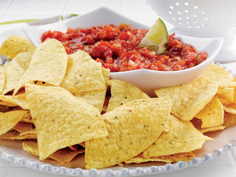 Nacho with Salsa on White Dish Food Picture