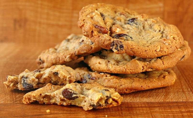 A Stack of Warm Homemade Oatmeal Raisin Cookies Food Picture