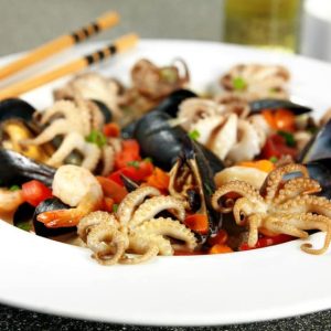 Cooked Octopus, Scallops and Mussels with Vegetables in White Ceramic Bowl Food Picture