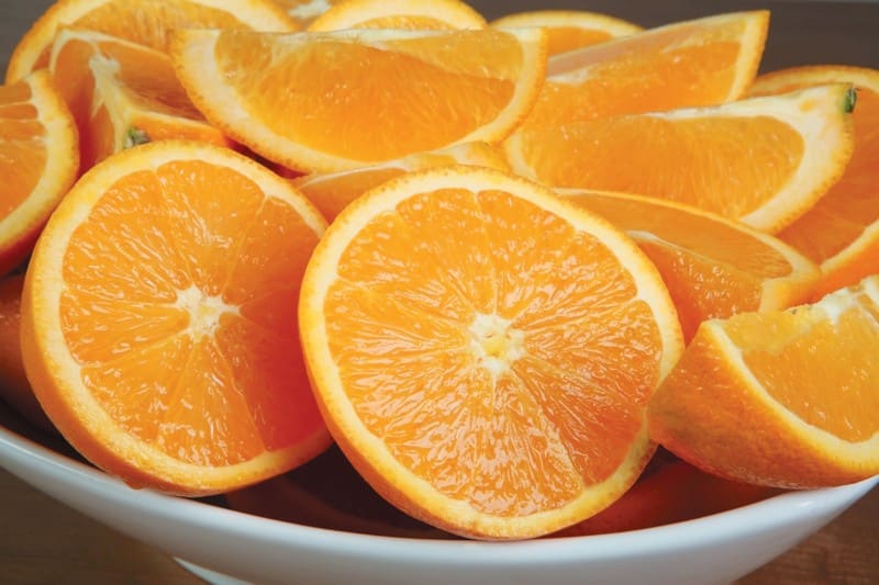 Fresh Wedged or Halved Oranges in Bowl Food Picture