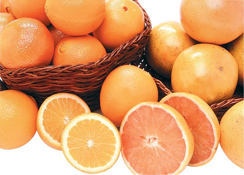 Fresh Sliced Oranges and Grapefruits in Baskets Food Picture