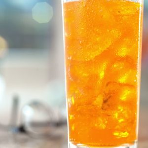 Refreshing Tall Glass of Orange Soda Food Picture