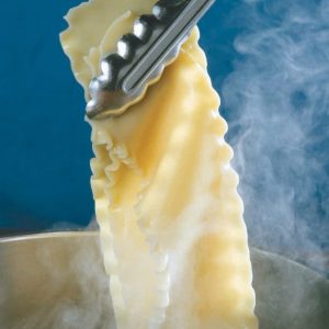 Steaming Pasta Being Held out of Pot with Tongues Food Picture