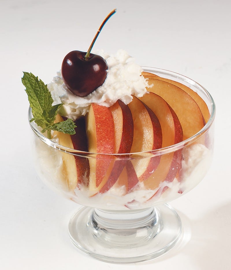Peaches with Whipped Cream on top Food Picture
