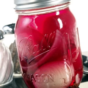 Just-Canned Pickled Egg with Onion and Beets in Crimson Brine on Granite Countertop Food Picture