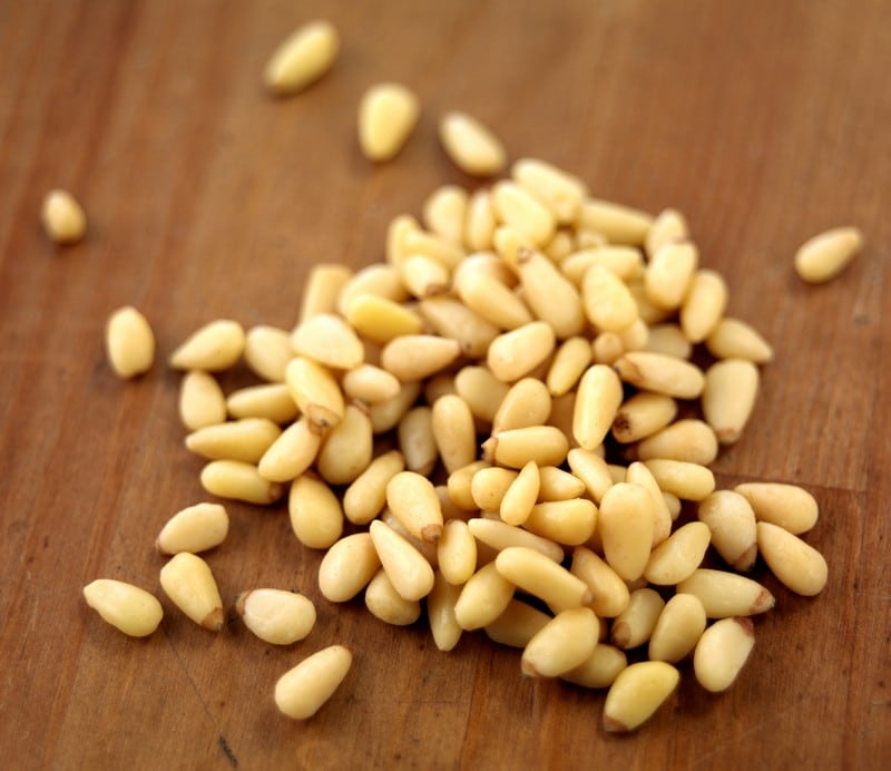 Fresh Pine Pignoli Nuts on Walnut Tabletop Food Picture