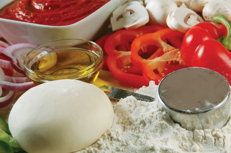 Pizza Dough with Flour, Oil, and Veggies Food Picture