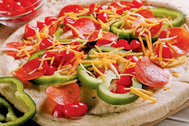 Uncooked Pizza with Toppings Food Picture