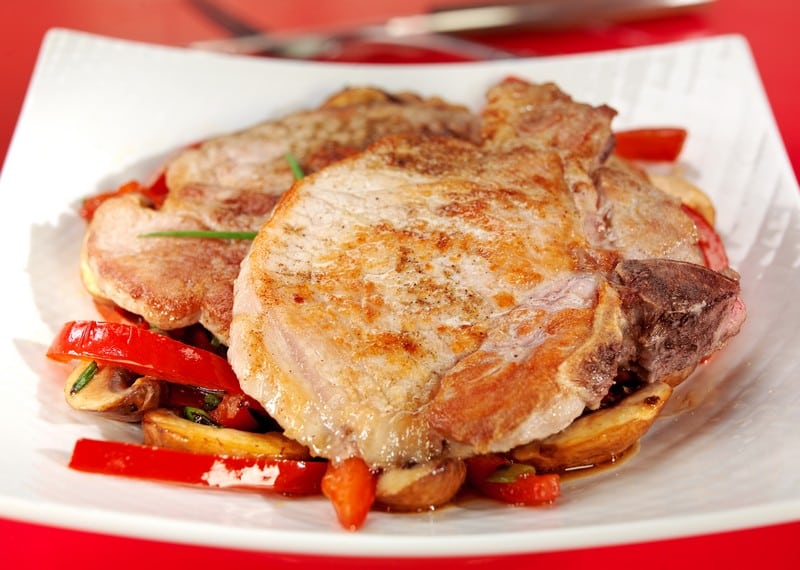 Cooked Center Cut Pork Chops over Vegetables Food Picture