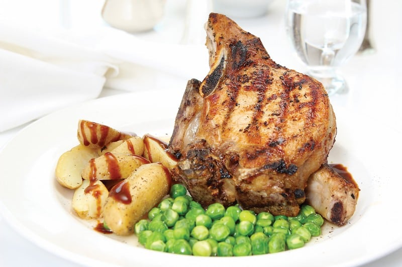 Pork Chops on a Plate with Peas and Potatoes Food Picture
