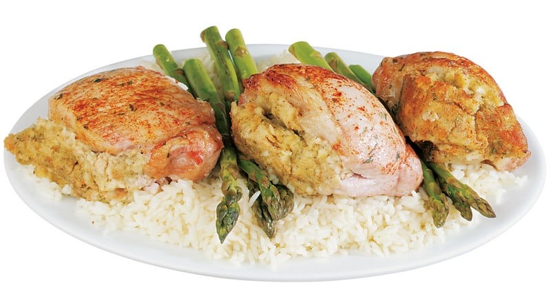 Stuffed Boneless Pork Chop on a Plate with Rice and Asparagus Food Picture