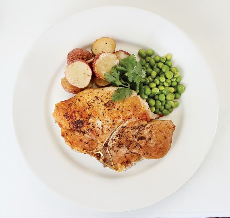 Pork Chops on a Plate with Peas and Potatoes Food Picture