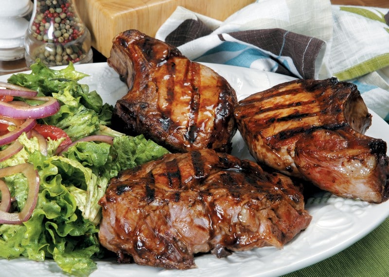Pork Chops with Grill Marks on a Plate with Salad Food Picture