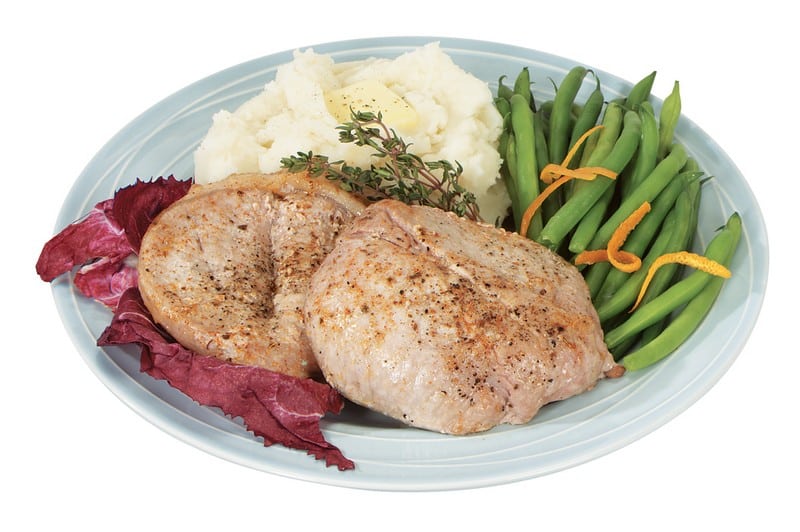Pork Chops on a Plate with String Beans and Potatoes Food Picture
