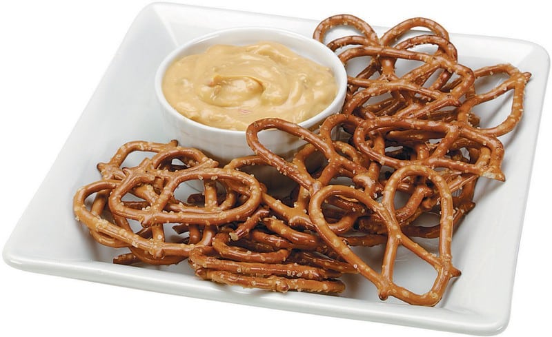 Thin Pretzels on a Plate with Cheese Dip Food Picture