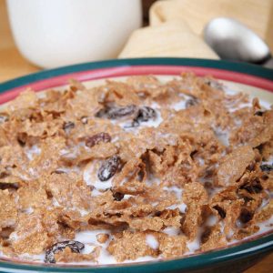 Raisin Cereal on a Bowl with Milk Food Picture