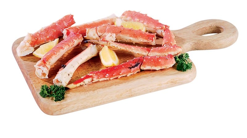 Raw Alaskan King Crab Legs with Garnish Food Picture