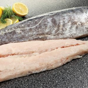 Whole King Fish Raw with Garnish on Countertop Surface Food Picture