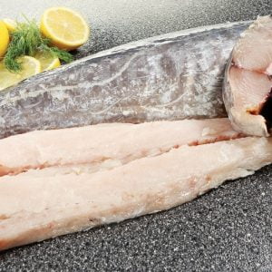 Whole Raw King Fish with Garnish on Countertop Food Picture