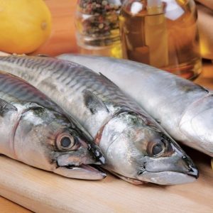 Whole Mackerel on wooden slab with lemon Food Picture