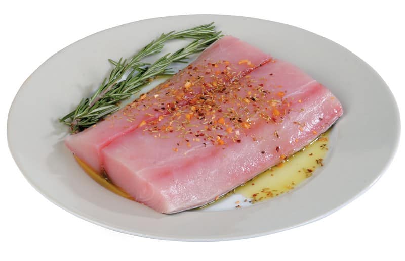 Raw Mahi Mahi Fillet with Oil and Garnish in White Dish Food Picture