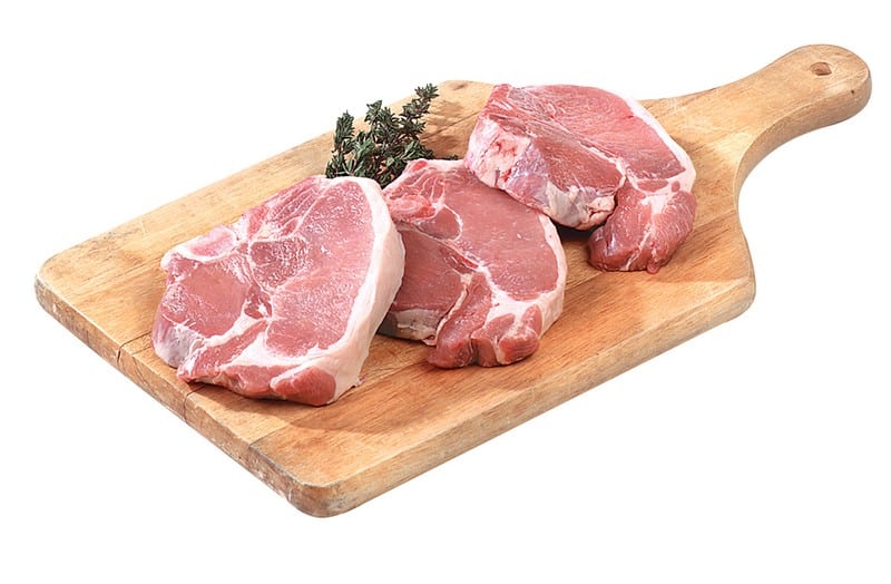 Fresh Raw Bone-In Pork Chops on Cutting Board Food Picture