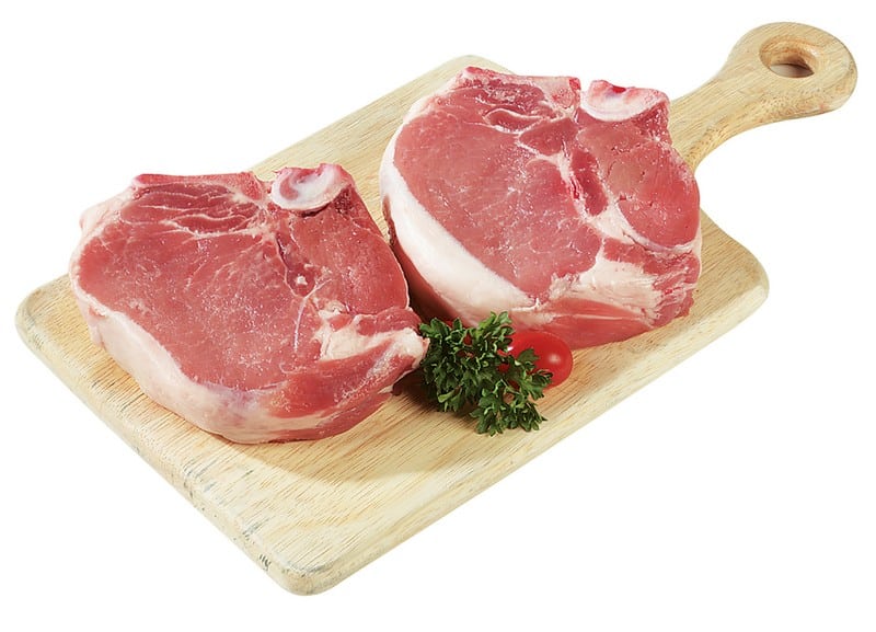 Fresh Raw Center Cut Bone-In Pork Chops on Cutting Board Food Picture