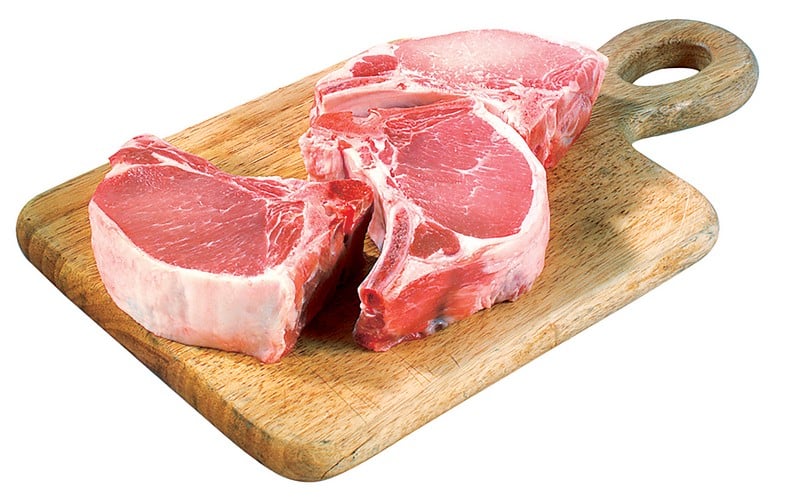 Fresh Raw Center Cut Bone-In Pork Chops on Cutting Board Food Picture