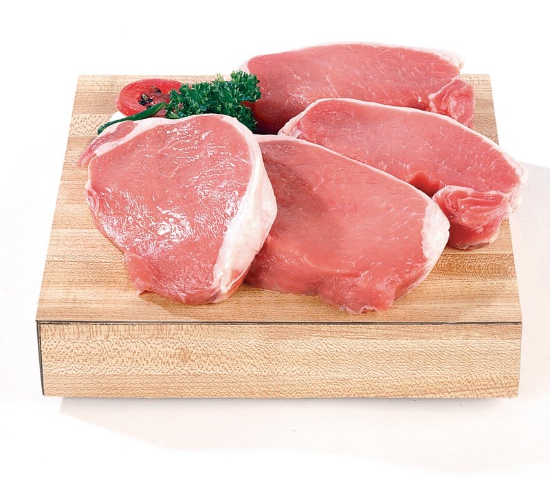 Fresh Raw Boneless Center Cut Pork Chops on Cutting Board Food Picture