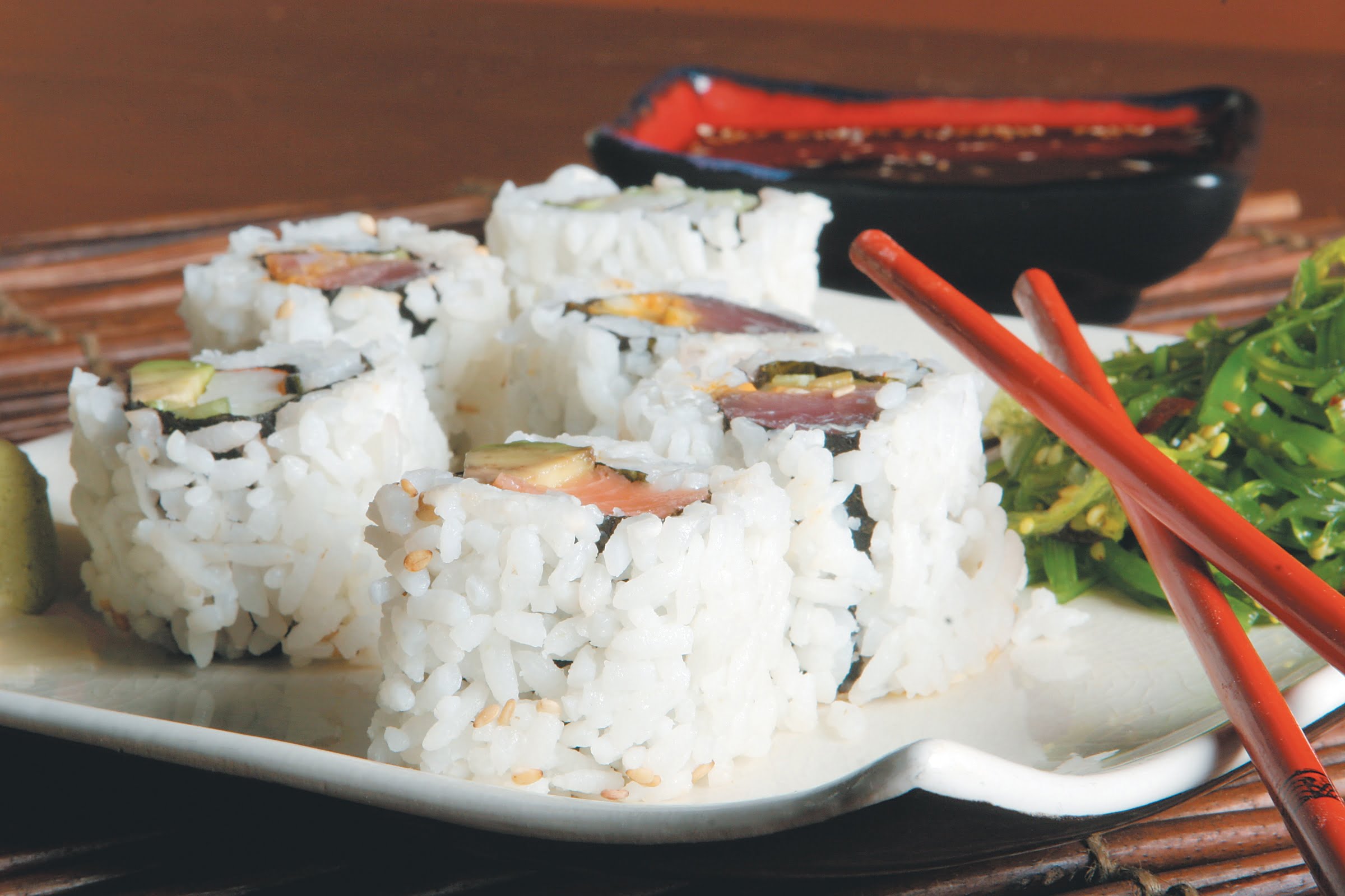 Raw Sushi on White Plate with Chopsticks Food Picture