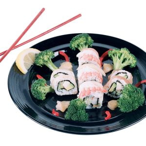 Raw Sushi with Veggies and Chopsticks on Black Plate Food Picture