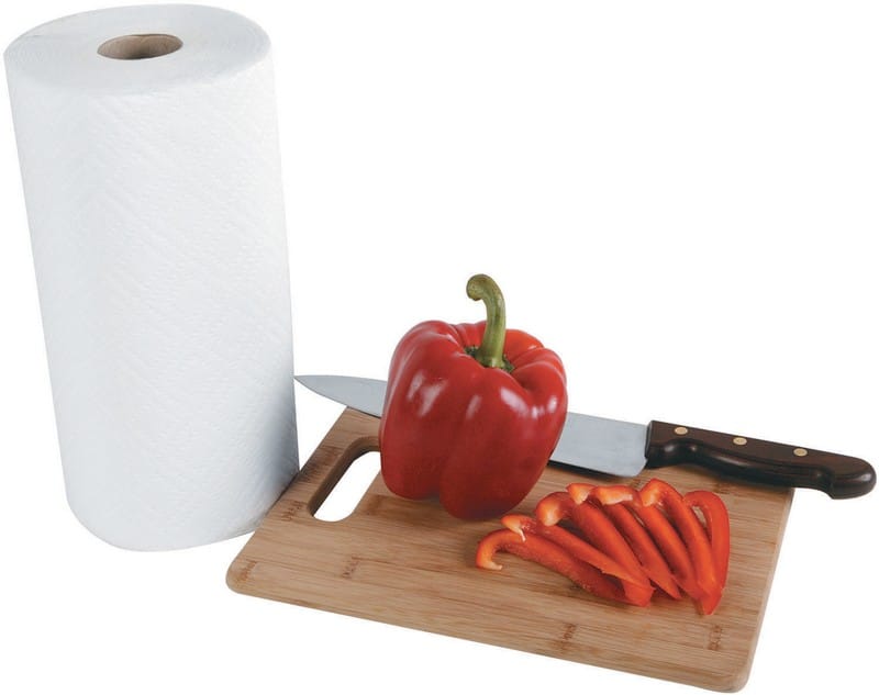 Whole and Sliced Red Peppers on Cutting Board with Paper Towel and a Knife Food Picture