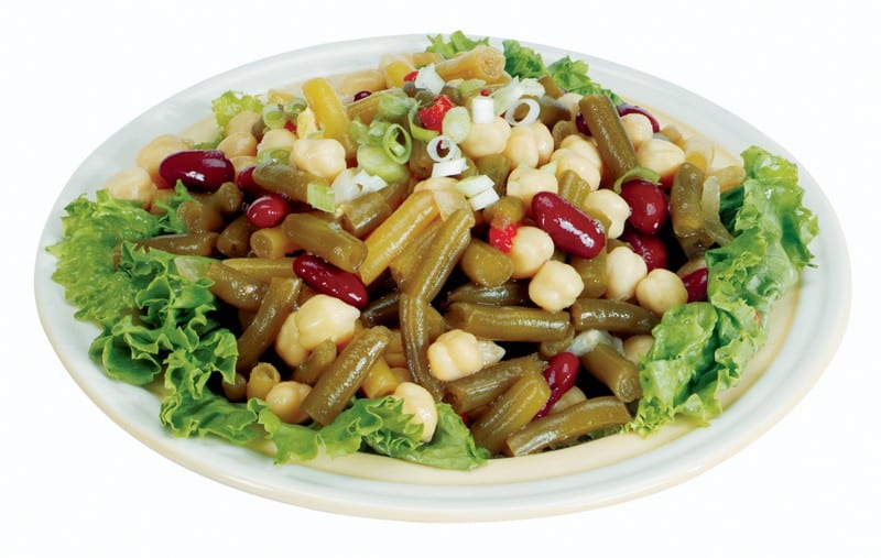 Bean Salad over Greens in White Bowl Food Picture