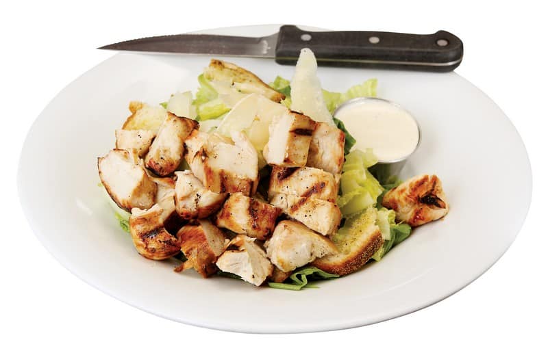 Chicken Caesar Salad with Knife Food Picture
