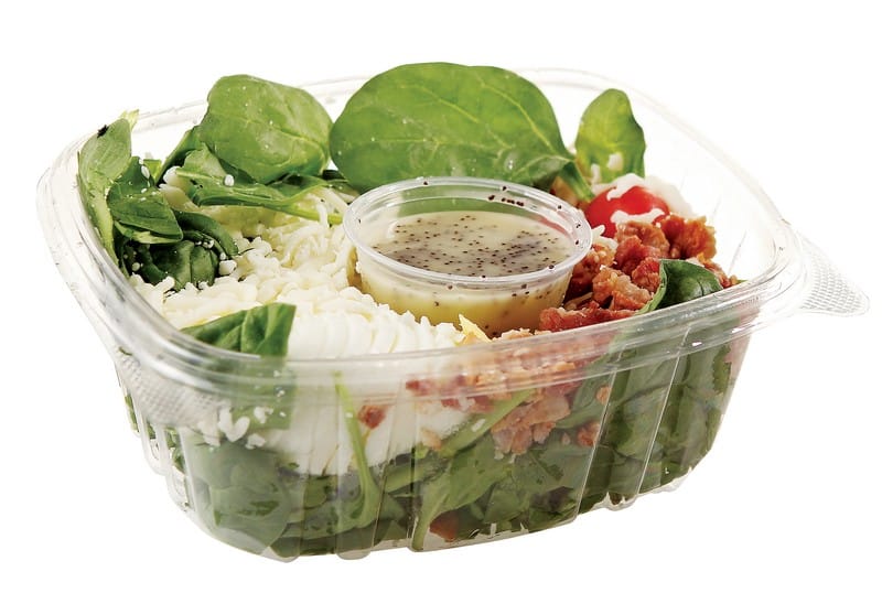 Clam Shell Salad in Plastic Container with Dressing Food Picture