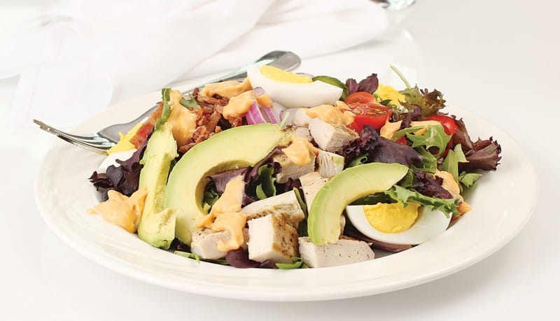 Cobb Salad in White Dish with Fork Food Picture