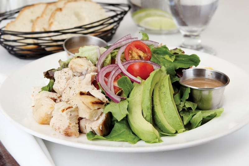 Cobb Salad on White Plate with Dressing on Side Food Picture