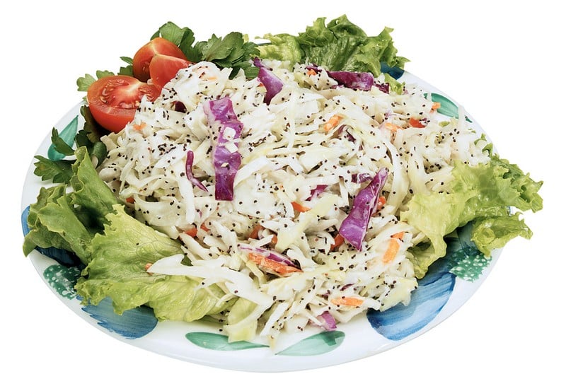 Coleslaw Salad over Greens on Decorative Plate Food Picture